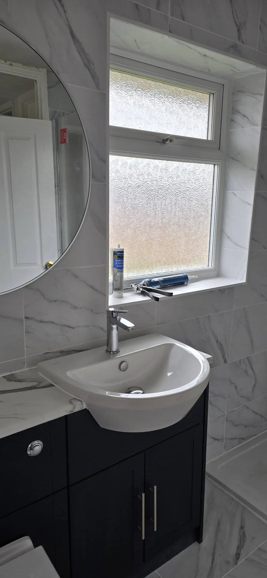 Newly fitted marble bathroom by A P Kerry Plumbing & Heating in King's Lynn